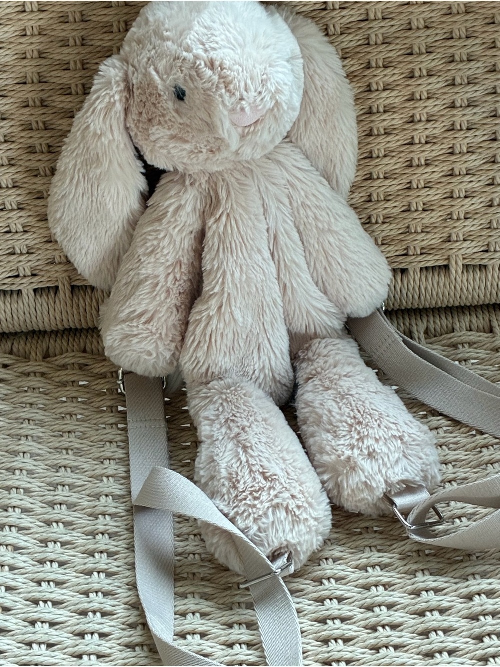 Jellycat Smudge Rabbit backpack, featuring ultra-soft beige plush fur .